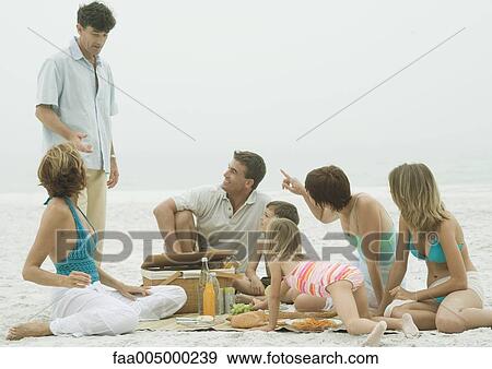 Group having picnic on beach View Large Photo Image Stock Photo - Group having picnic on beach. Fotosearch