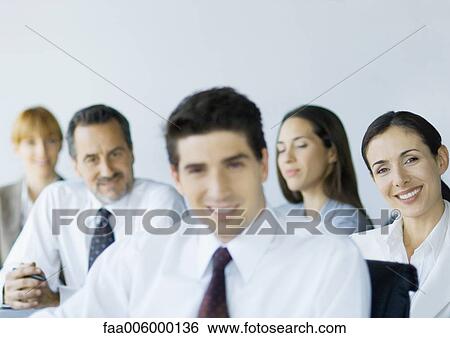 Stock Photograph - Group of business colleagues smiling. Fotosearch