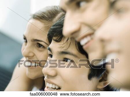 Group of young adult friends, close-up of faces View Large Photo Image Stock Photo - Group of young adult friends, close-up of faces. Fotosearch