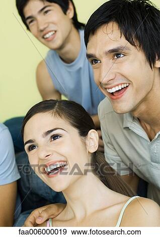 Group of young adult friends smiling View Large Photo Image Stock Photo - Group of young adult friends smiling. Fotosearch