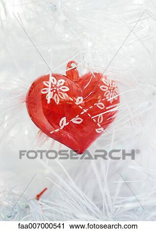 Heart ornament on white christmas tree View Large Photo Image Stock Image - Heart ornament on white christmas tree. Fotosearch