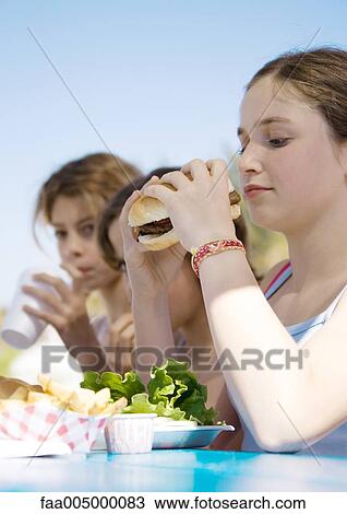 Kids eating hamburgers View Large Photo Image Stock Image - Kids eating hamburgers. Fotosearch