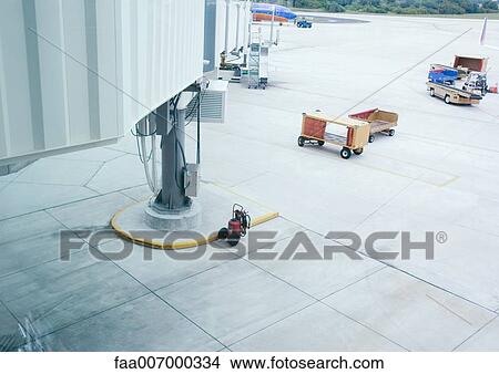 Luggage containers on airport tarmac View Large Photo Image Picture - Luggage containers on airport tarmac. Fotosearch