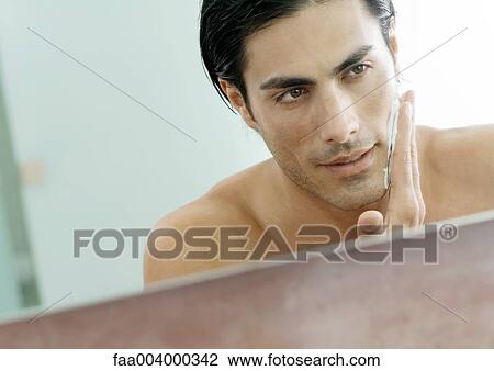 Man applying shaving cream View Large Photo Image Stock Image - Man applying shaving cream. Fotosearch