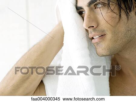 Man drying off face with towel View Large Photo Image Stock Photography - Man drying off face with towel. Fotosearch