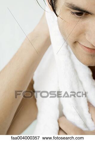Man drying off with towel, cropped View Large Photo Image Stock Photo - Man drying off with towel, cropped. Fotosearch