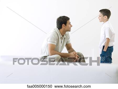 Man having talk with son View Large Photo Image Stock Image - Man having talk with son. Fotosearch
