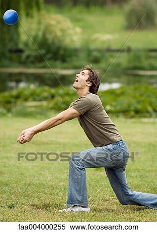 Man kneeling to hit volleyball View Large Photo Image Stock Photography - Man kneeling to hit volleyball. Fotosearch