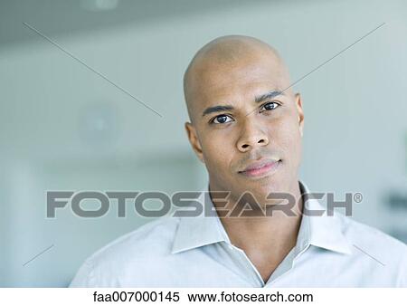Stock Photography - Man looking at camera, portrait. Fotosearch