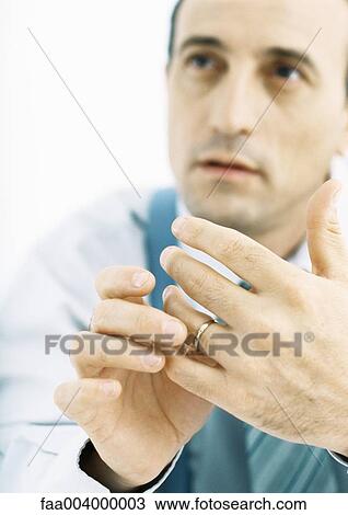 Man playing with wedding ring View Large Photo Image Stock Image - Man playing with wedding ring. Fotosearch