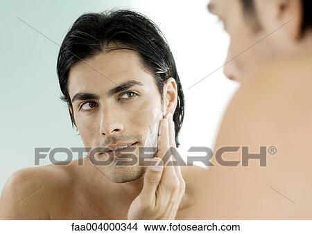 Man putting on shaving cream in mirror View Large Photo Image Picture - Man putting on shaving cream in mirror. Fotosearch