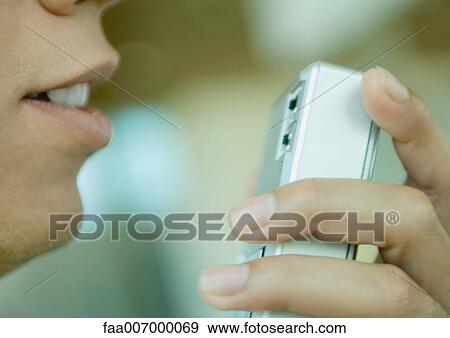 Stock Photo - Man using dictaphone. Fotosearch
