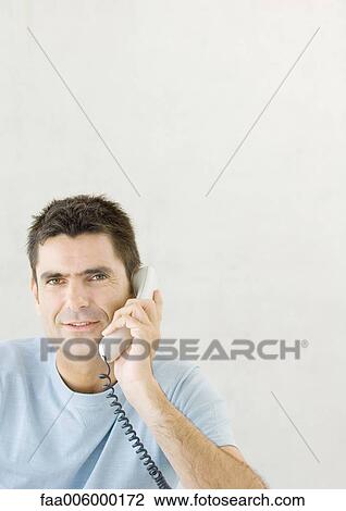 Man using phone View Large Photo Image Stock Image - Man using phone. Fotosearch