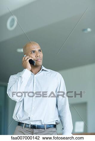 Man using phone View Large Photo Image Stock Image - Man using phone. Fotosearch