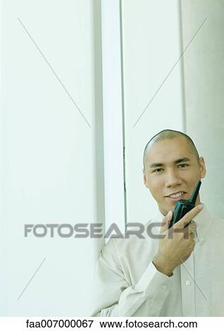 Man using walkie-talkie View Large Photo Image Stock Photo - Man using walkie-talkie. Fotosearch