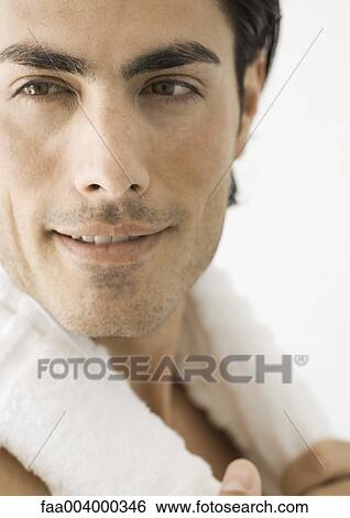 Man with towel around neck, close-up View Large Photo Image Stock Photograph - Man with towel around neck, close-up. Fotosearch