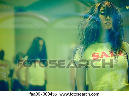 Mannequin in store window wearing sale t-shirt View Large Photo Image Stock Photography - Mannequin in store window wearing sale t-shirt. Fotosearch