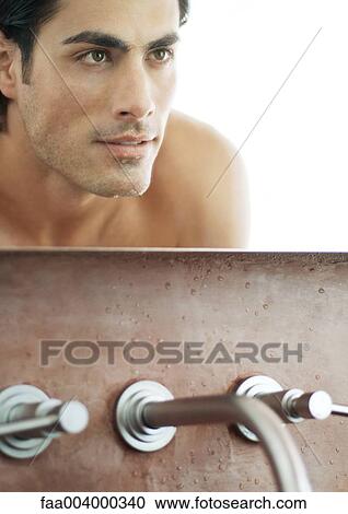 Man's face in bathroom mirror View Large Photo Image Stock Image - Man's face in bathroom mirror. Fotosearch