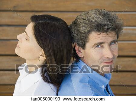 Mature couple, back to back View Large Photo Image Stock Photo - Mature couple, back to back. Fotosearch