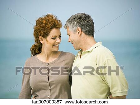 Mature couple, sea in background View Large Photo Image Stock Photo - Mature couple, sea in background. Fotosearch