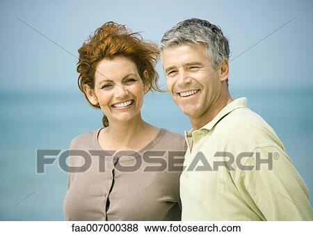 Mature couple, sea in background View Large Photo Image Stock Photo - Mature couple, sea in background. Fotosearch