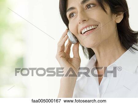 Mature woman using cell phone View Large Photo Image Stock Photo - Mature woman using cell phone. Fotosearch