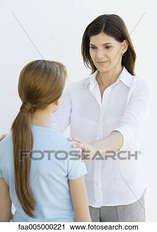 Mother holding preteen daughter at arms length View Large Photo Image Stock Image - Mother holding preteen daughter at arms length. Fotosearch