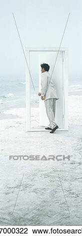 On beach, businessman opening door View Large Photo Image Stock Image - On beach, businessman opening door. Fotosearch