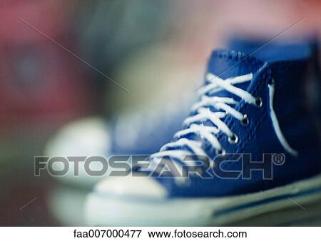 Stock Photo - Pair of blue canvas shoes. Fotosearch