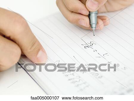 Parent helping child with math homework, close-up of hands View Large Photo Image Stock Photo - Parent helping child with math homework, close-up of hands. Fotosearch