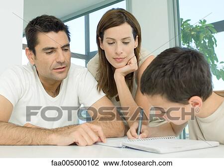 Parents helping son with homework View Large Photo Image Stock Image - Parents helping son with homework. Fotosearch