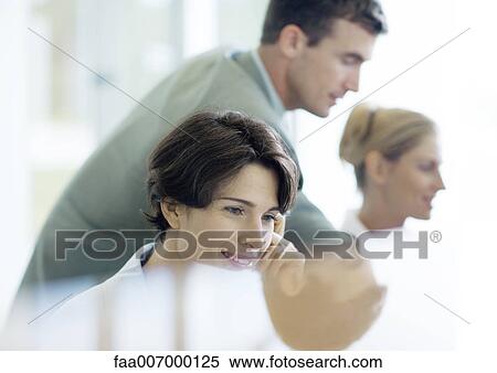 People working behind counter View Large Photo Image Stock Photography - People working behind counter. Fotosearch