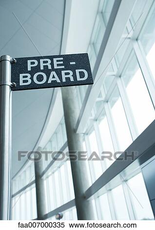 Pre-board sign in airport View Large Photo Image Stock Photography - Pre-board sign in airport. Fotosearch