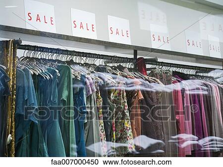 Racks of clothing in store during sale View Large Photo Image Stock Image - Racks of clothing in store during sale. Fotosearch