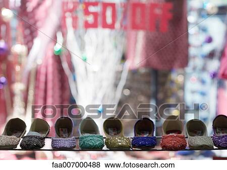 Stock Photo - Row of shoes in front of shop window. Fotosearch