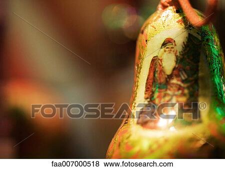 Santa Claus on bell shaped ornament View Large Photo Image Stock Photo - Santa Claus on bell shaped ornament. Fotosearch