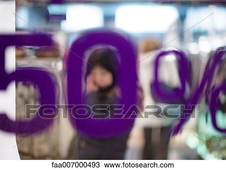 Stock Image - Shop window with text "50% off". Fotosearch