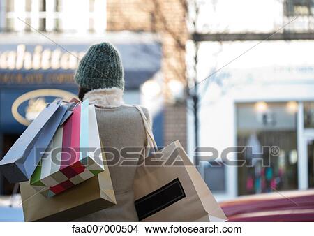 Shopper with shopping bags View Large Photo Image Picture - Shopper with shopping bags. Fotosearch