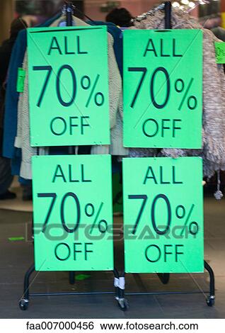 Signs on rack of clothing with text "all 70% off" View Large Photo Image Stock Photograph - Signs on rack of clothing with text "all 70% off". Fotosearch