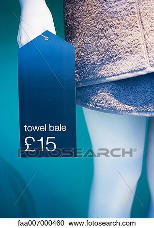 Store mannequin wrapped in towel with price tag hanging on hand, close-up View Large Photo Image Stock Image - Store mannequin wrapped in towel with price tag hanging on hand, close-up. Fotosearch