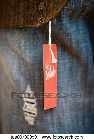 Tag attached to article of clothing, close-up View Large Photo Image Stock Image - Tag attached to article of clothing, close-up. Fotosearch
