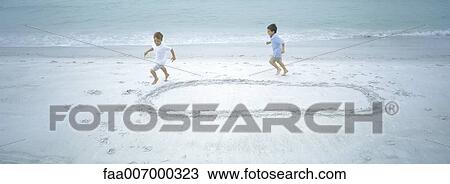 Two boys running around shape on beach View Large Photo Image Stock Image - Two boys running around shape on beach. Fotosearch