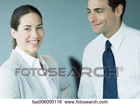 Stock Photograph - Two business colleagues smiling. Fotosearch