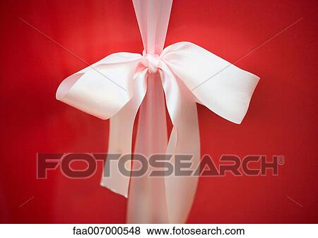 White bow on red package, close-up View Large Photo Image Stock Photo - White bow on red package, close-up. Fotosearch