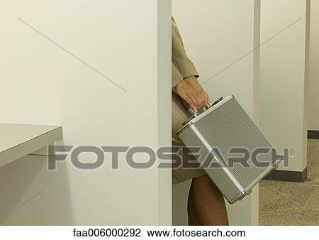 Woman behind partition, holding briefcase over knees, cropped View Large Photo Image Stock Image - Woman behind partition, holding briefcase over knees, cropped. Fotosearch