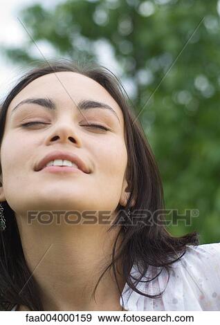 Woman closing eyes, close-up View Large Photo Image Stock Photo - Woman closing eyes, close-up. Fotosearch