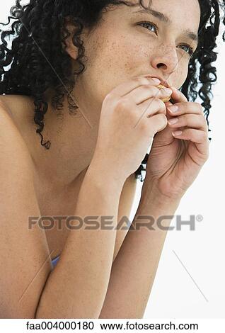 Stock Image - Woman eating. Fotosearch