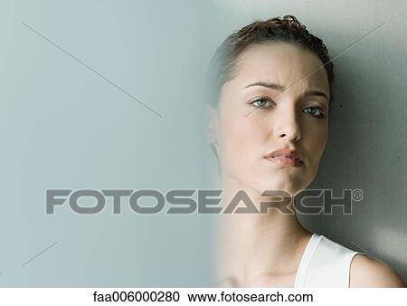 Woman furrowing brow View Large Photo Image Stock Image - Woman furrowing brow. Fotosearch
