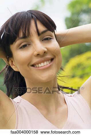 Woman holding hair back View Large Photo Image Stock Photo - Woman holding hair back. Fotosearch