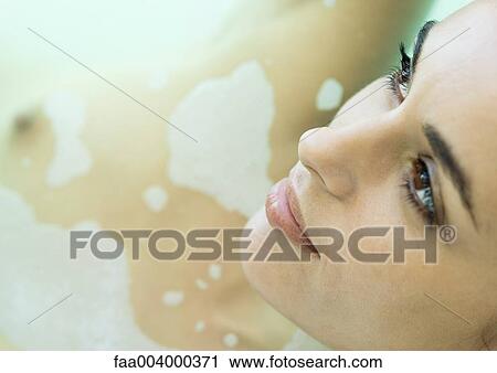 Woman in bath, close-up of face View Large Photo Image Stock Image - Woman in bath, close-up of face. Fotosearch